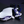 White and blue Azeron device with the name 'Keyzen' on a dark background